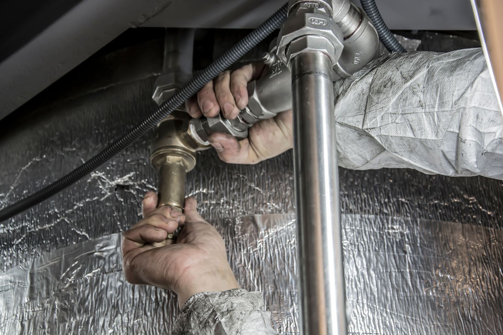 Plumbing trainee working on equipment